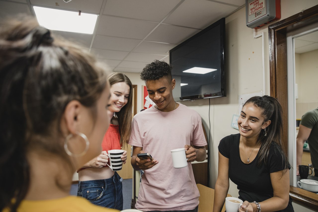 Teenagers talking to each other.